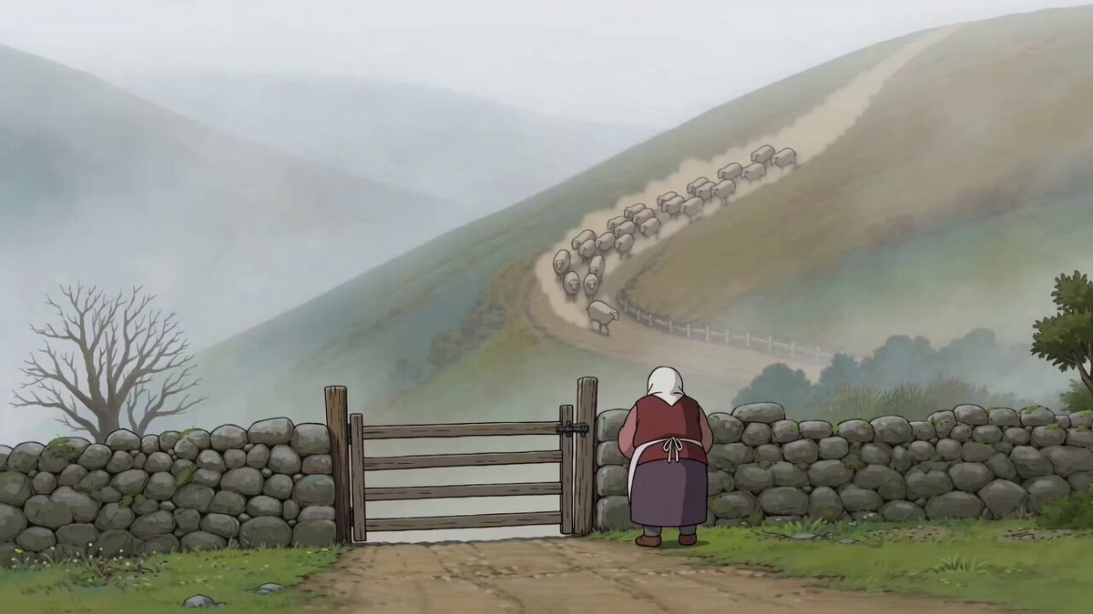 sheep on misty hillside