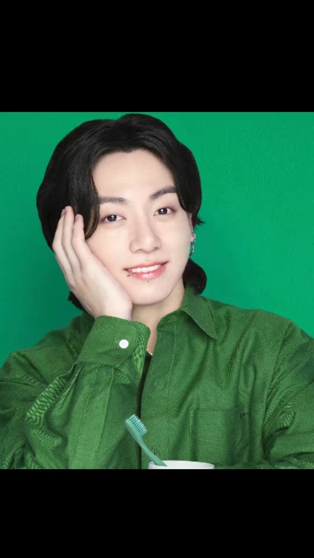 young man in green collared shirt