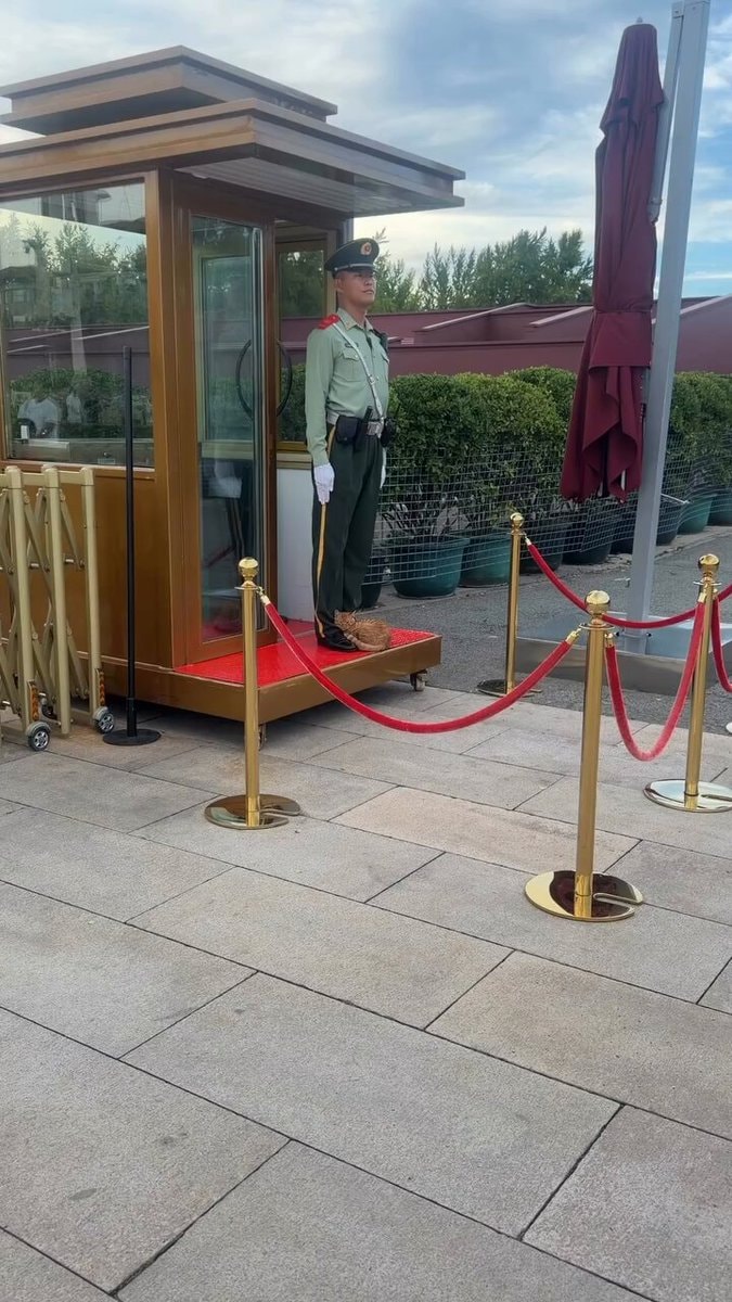 Soldier standing guard at booth