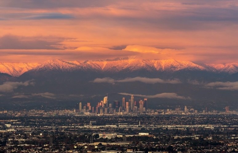 City skyline with mountains at sunset (photo 2 of 4)