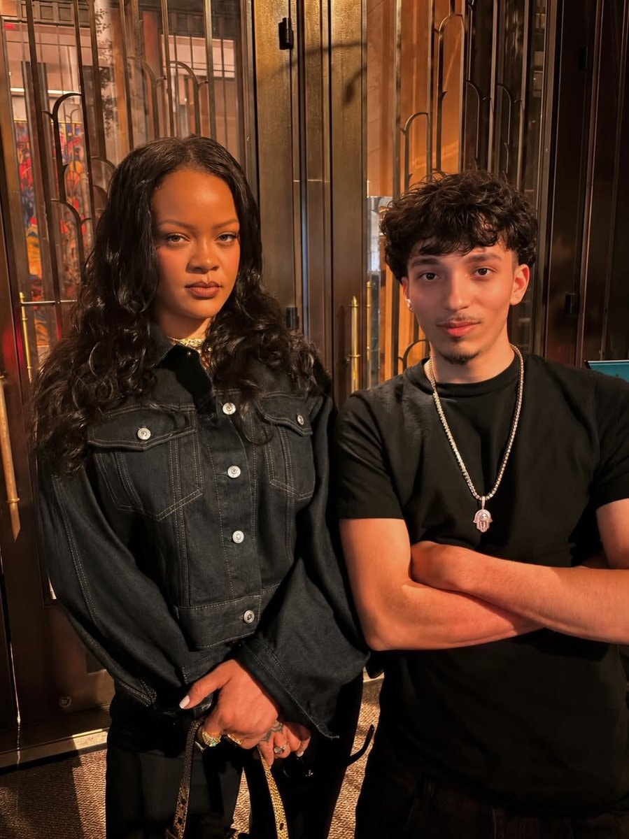Rihanna with fan in NYC (photo 2 of 2)