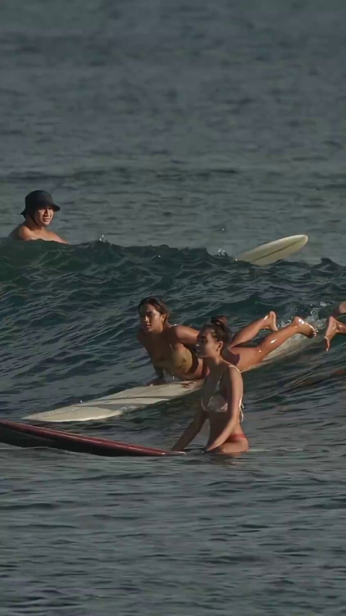 Surfers in calm blue ocean Surfers in calm blue ocean