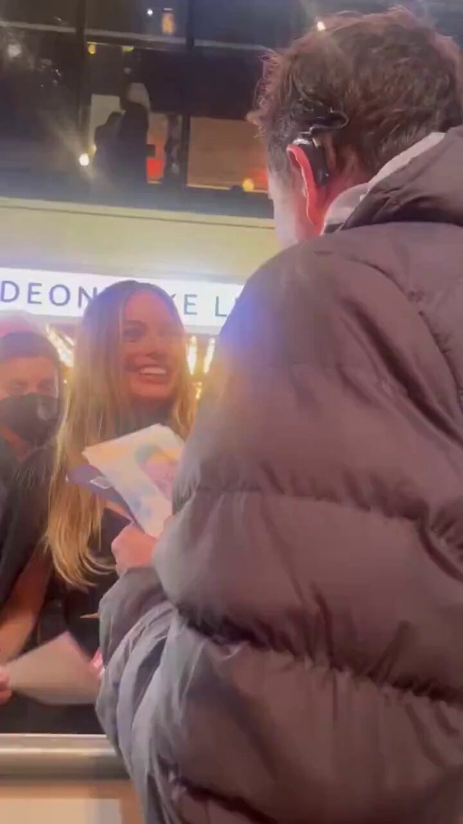 Margot Robbie uses sign language