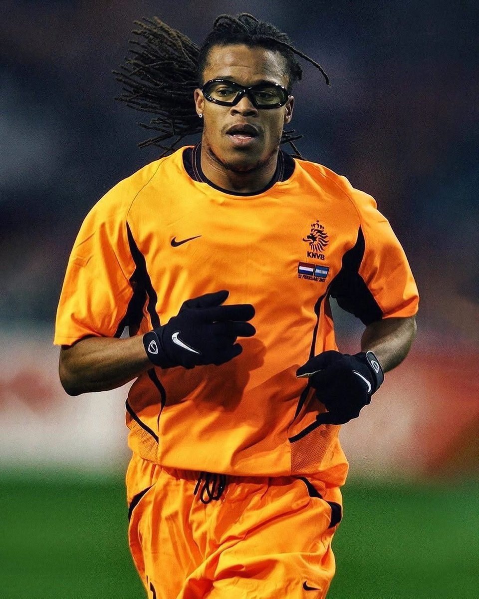 star soccer player in orange uniform