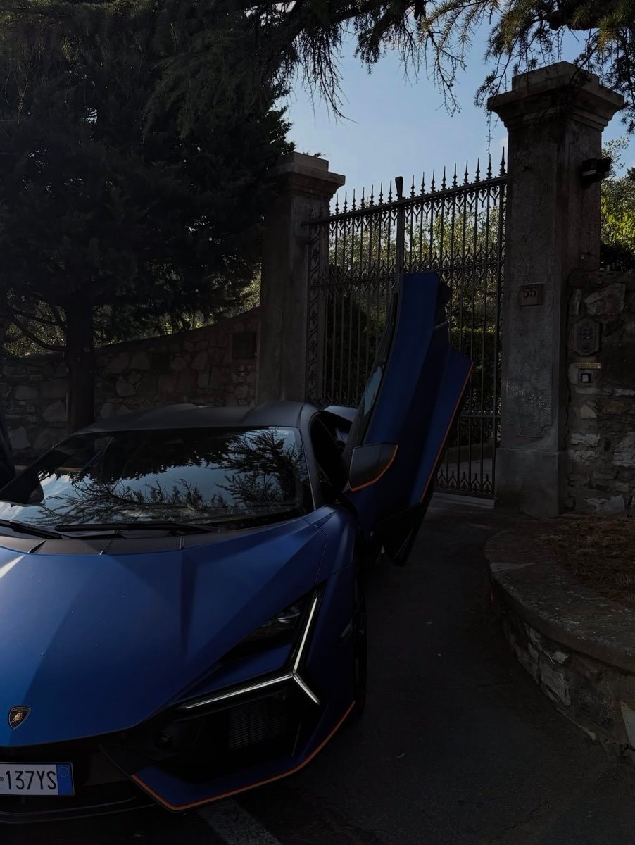 matte blue supercar with orange accents