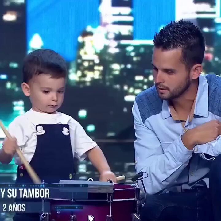 kid drumming on the drums