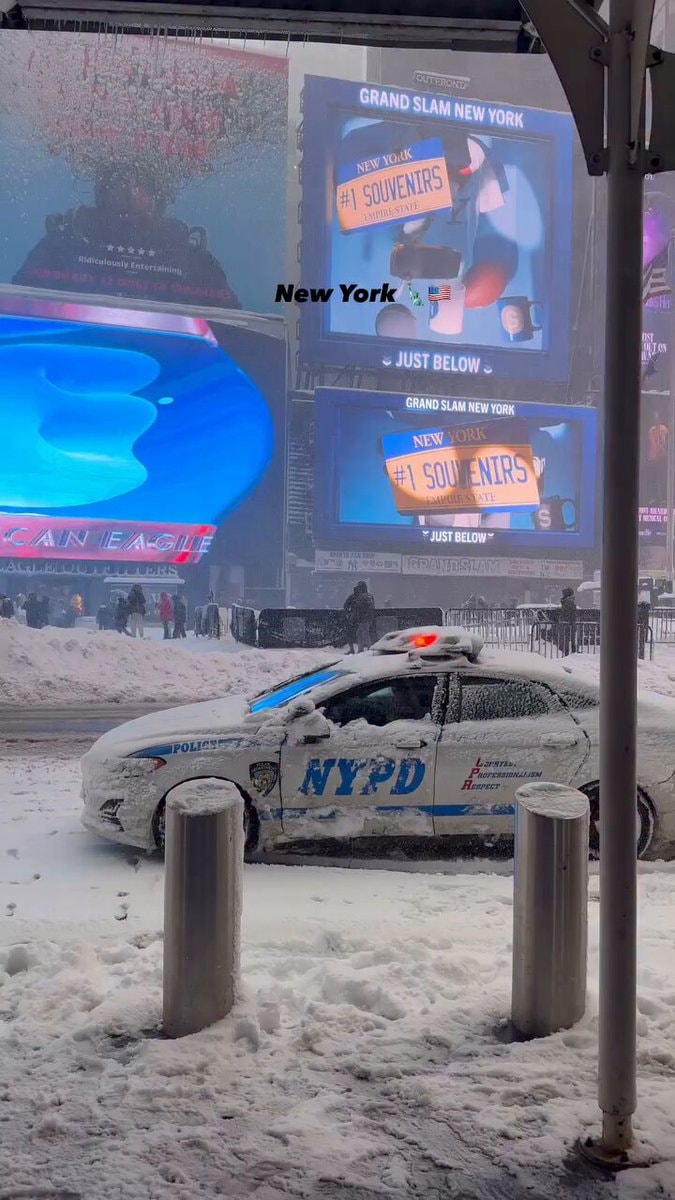 NYC winter snow on police car NYC winter snow on police car