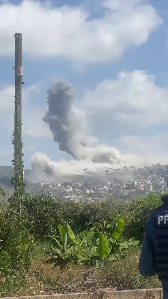 Smoke rises over Al-Mansouri