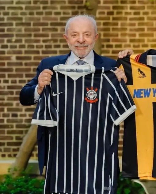 President Lula holds soccer jerseys
