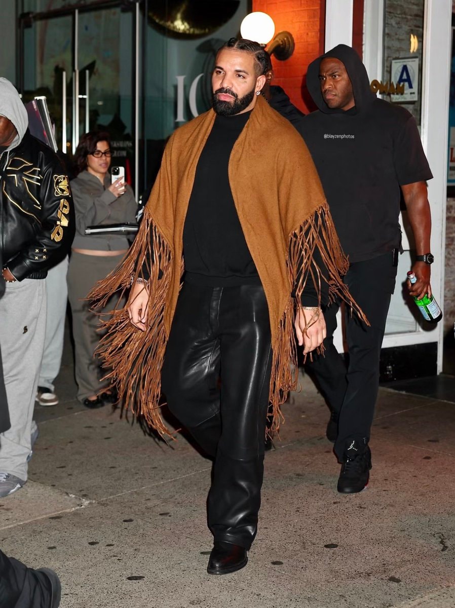 Drake walking with security