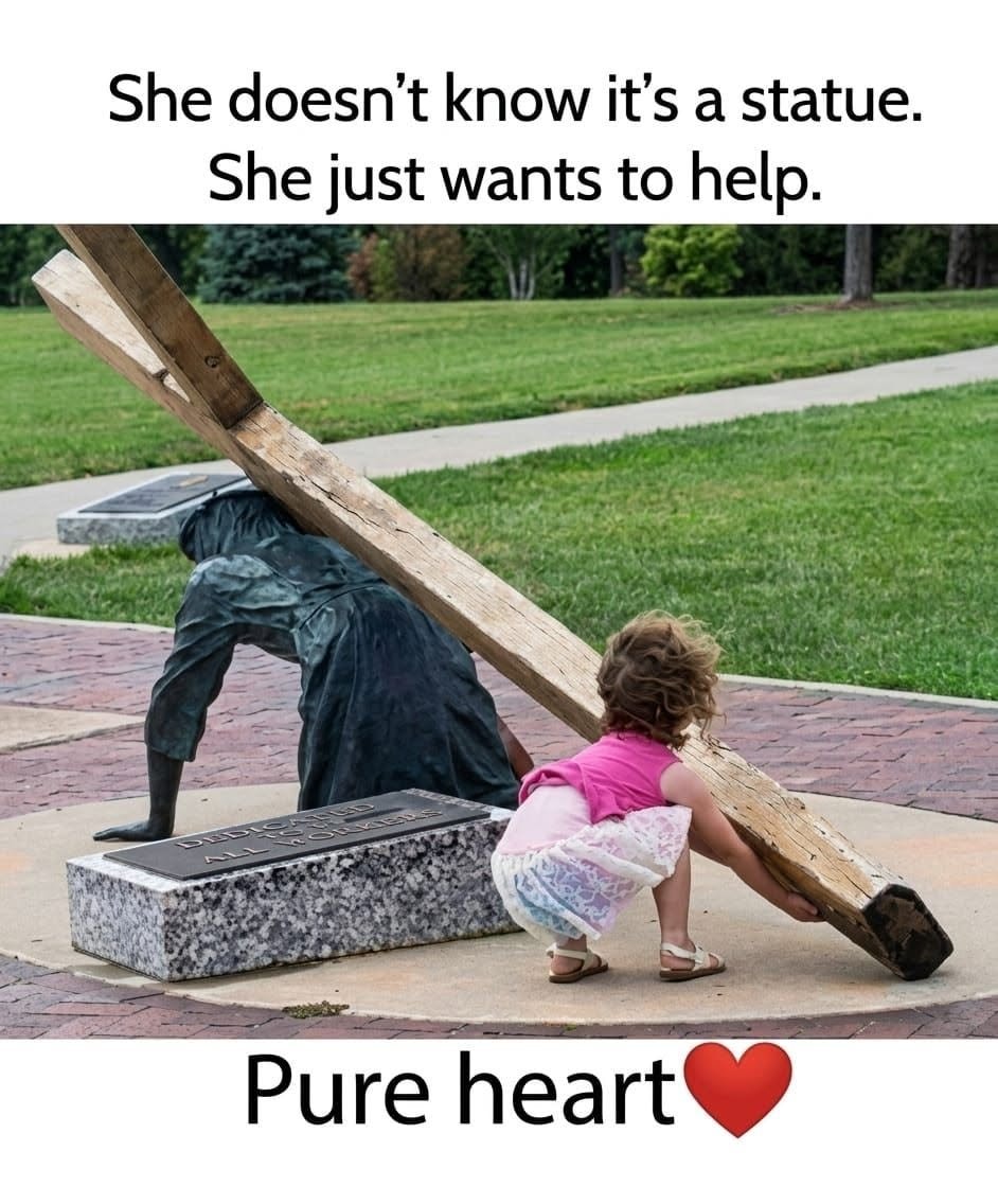 Child trying to lift statue cross