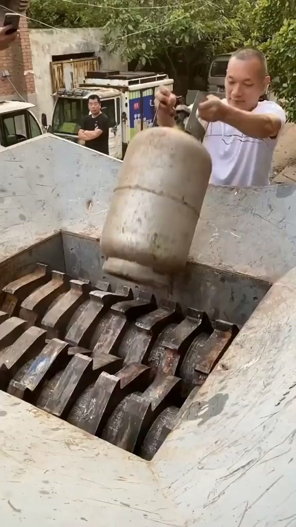 Industrial shredder takes on a propane tank
