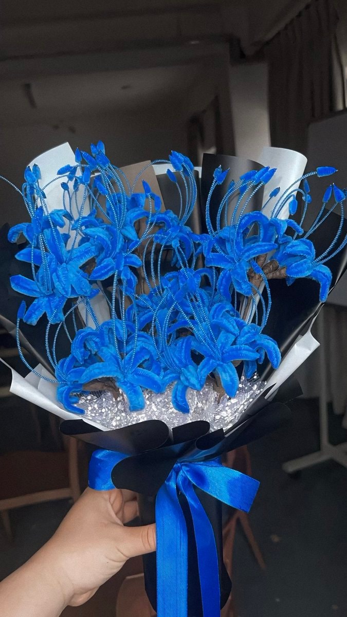 blue spider lily hand (photo 2 of 2)