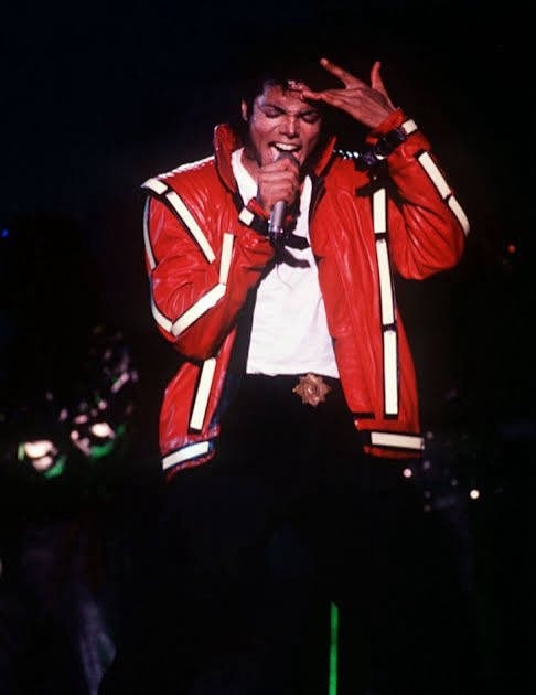 Singer red leather jacket stage performance (photo 3 of 4)