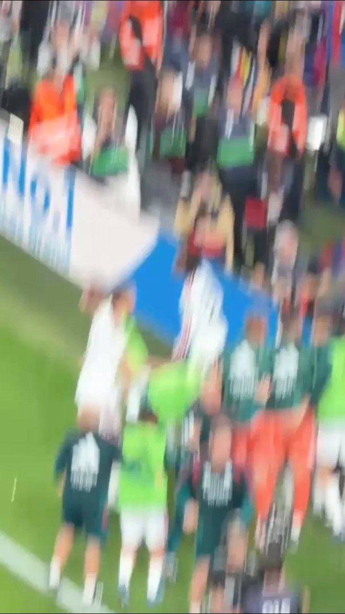 Barcelona fans throw objects at Real Madrid players