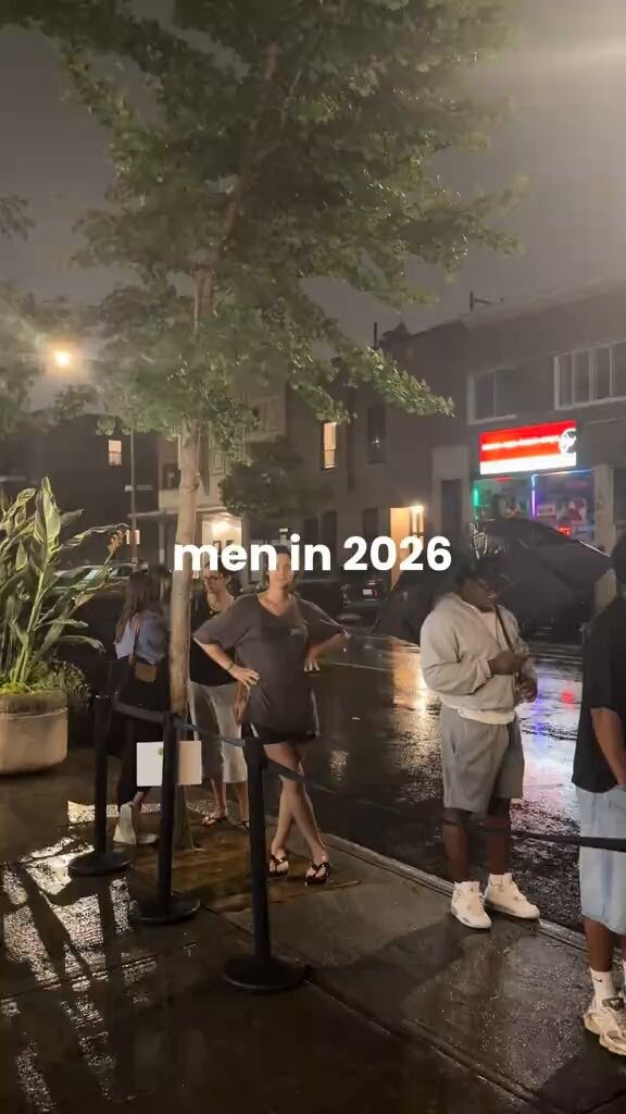 Woman calls out man for umbrella in rain