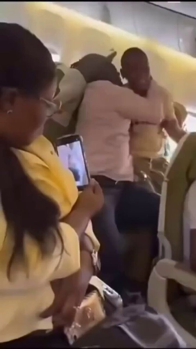 Father calms autistic son on plane Father calms autistic son on plane