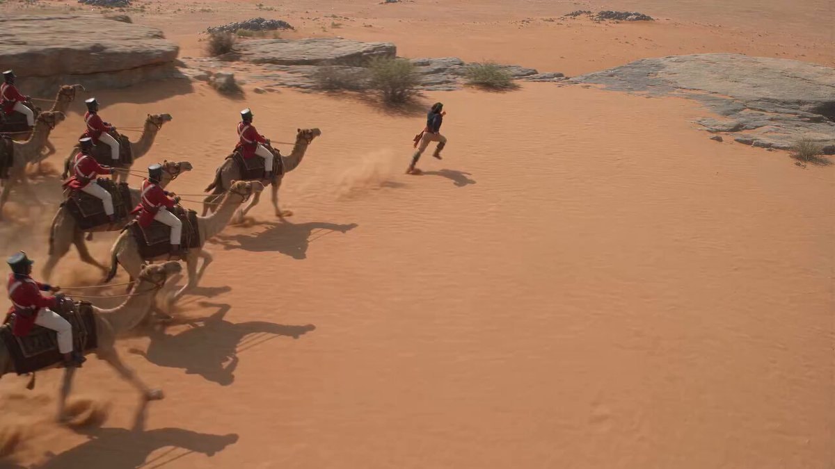 Fugitive fights camel soldiers with a snake