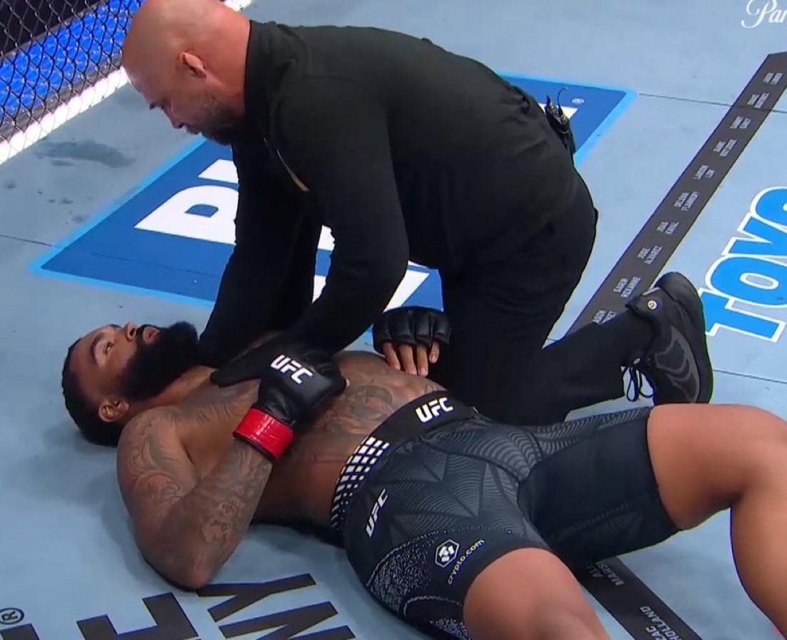 UFC fighter on mat with referee