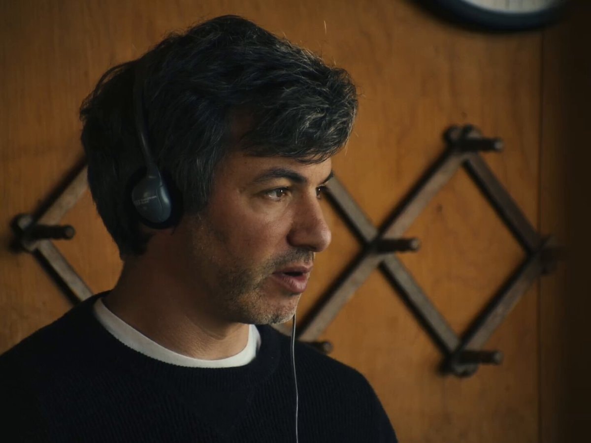 man wearing headphones serious look