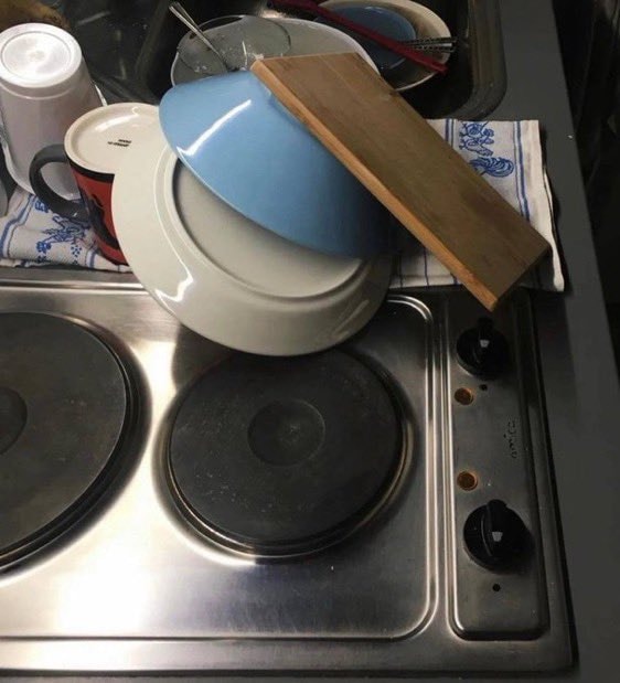 messy kitchen sink and stove