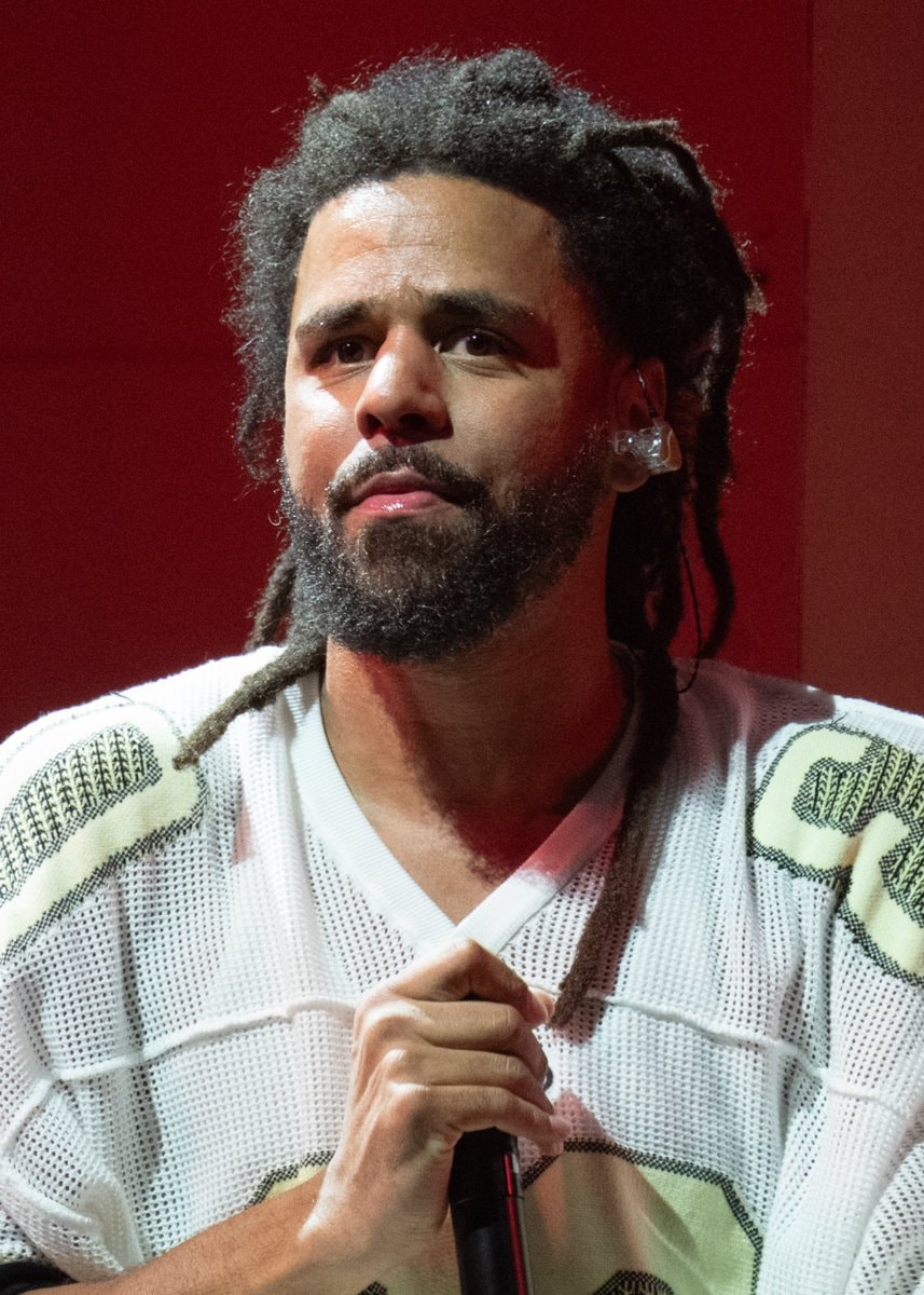 J. Cole performing live on stage