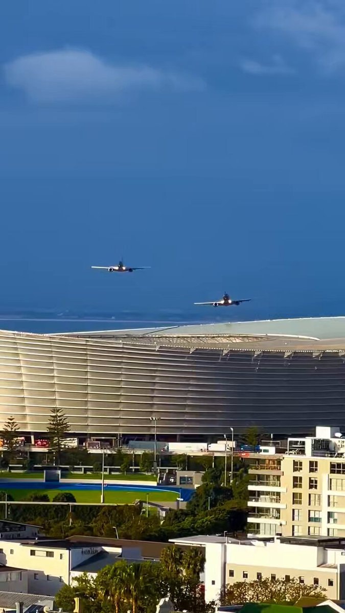 airplanes flying over stadium