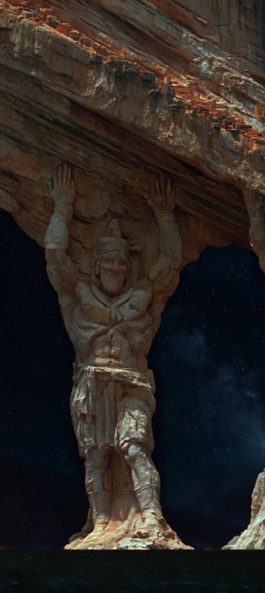 Carved stone Atlas figure