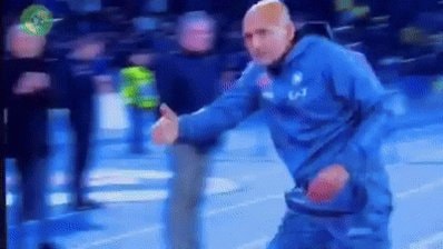 Bald man in blue tracksuit reaction