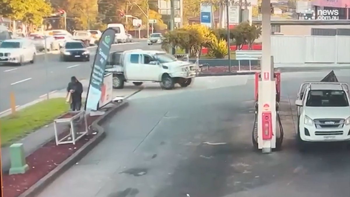 car nears pedestrian Australia