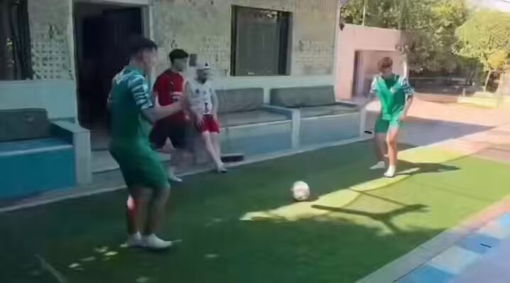 Backyard soccer game moment