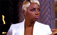 woman in white blazer skeptical look