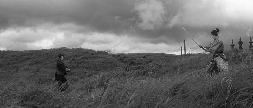 B&W cinematography lone man in field (photo 3 of 4)