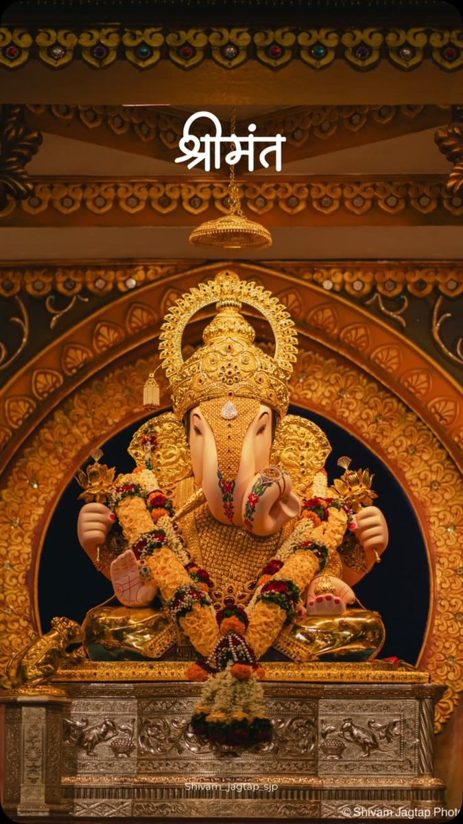 Lord Ganesh statue with garlands