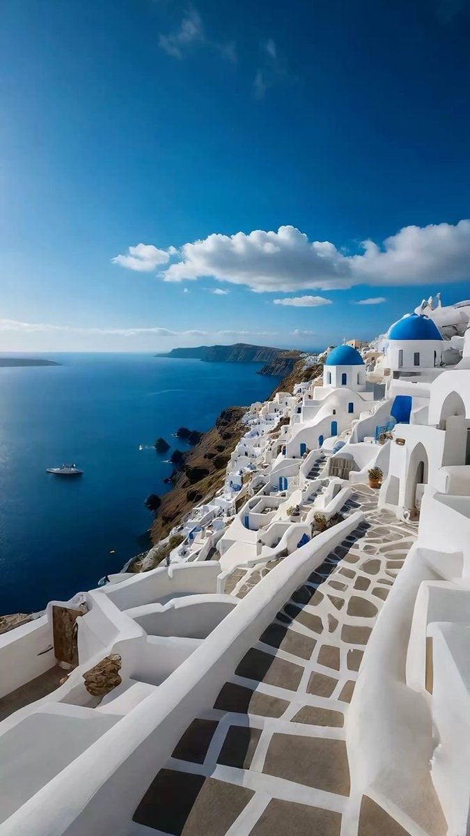 Greece cliffside village at sunset (photo 2 of 4)