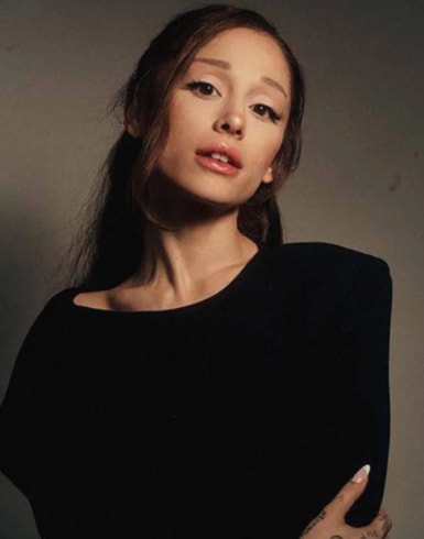 Olivia Rodrigo listening to Petal by Ariana Grande (photo 1 of 2)