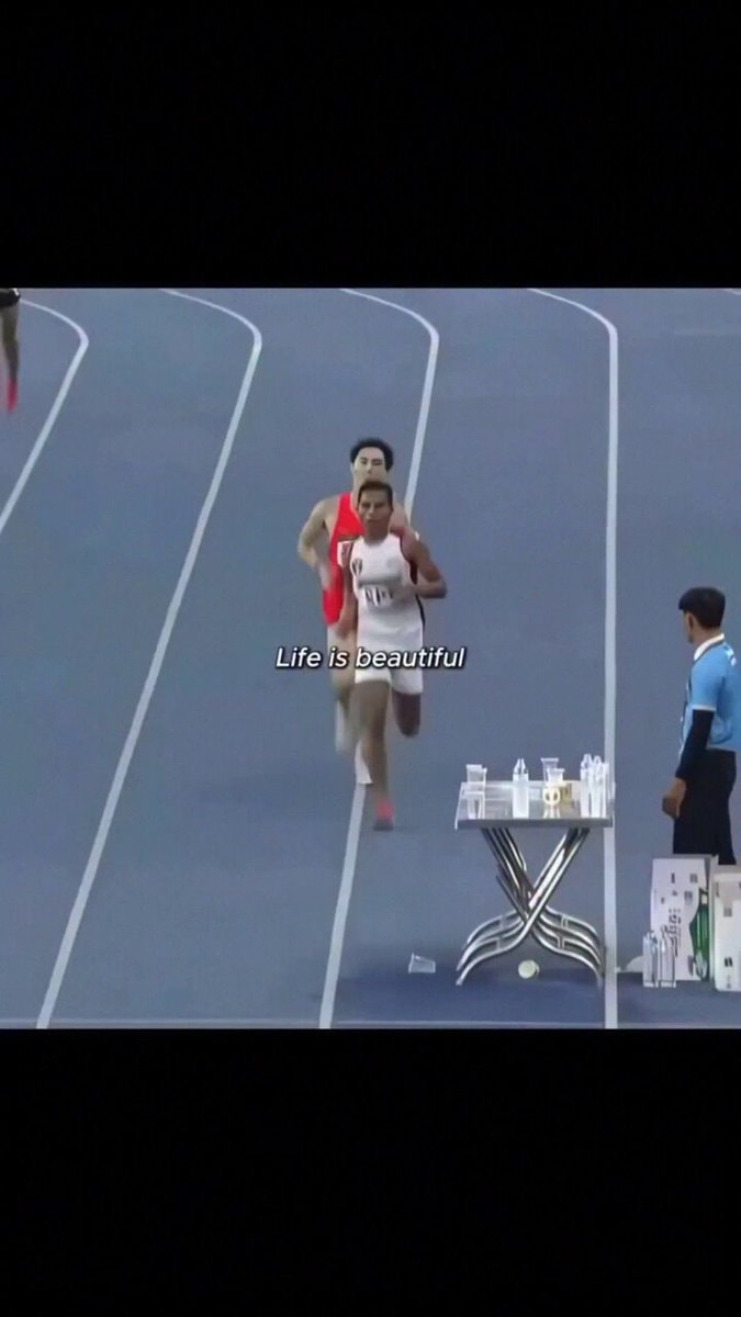 Runners competing on track