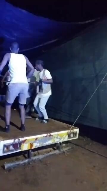 guys on a flatbed trailer at night