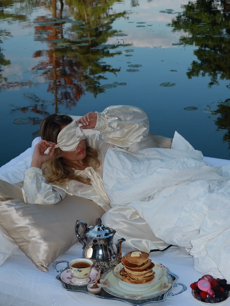 woman stretching on floating mattress (photo 2 of 4)