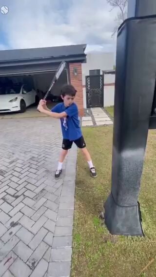 Boy swings bat and fouls ball