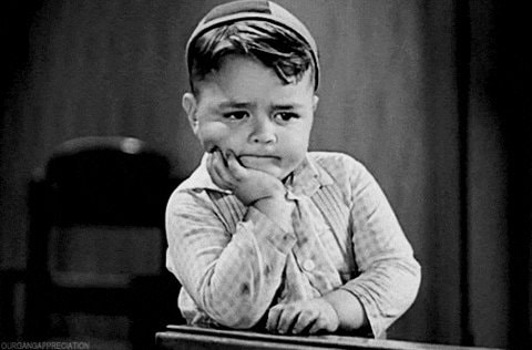Melancholic boy with striped cap GIF