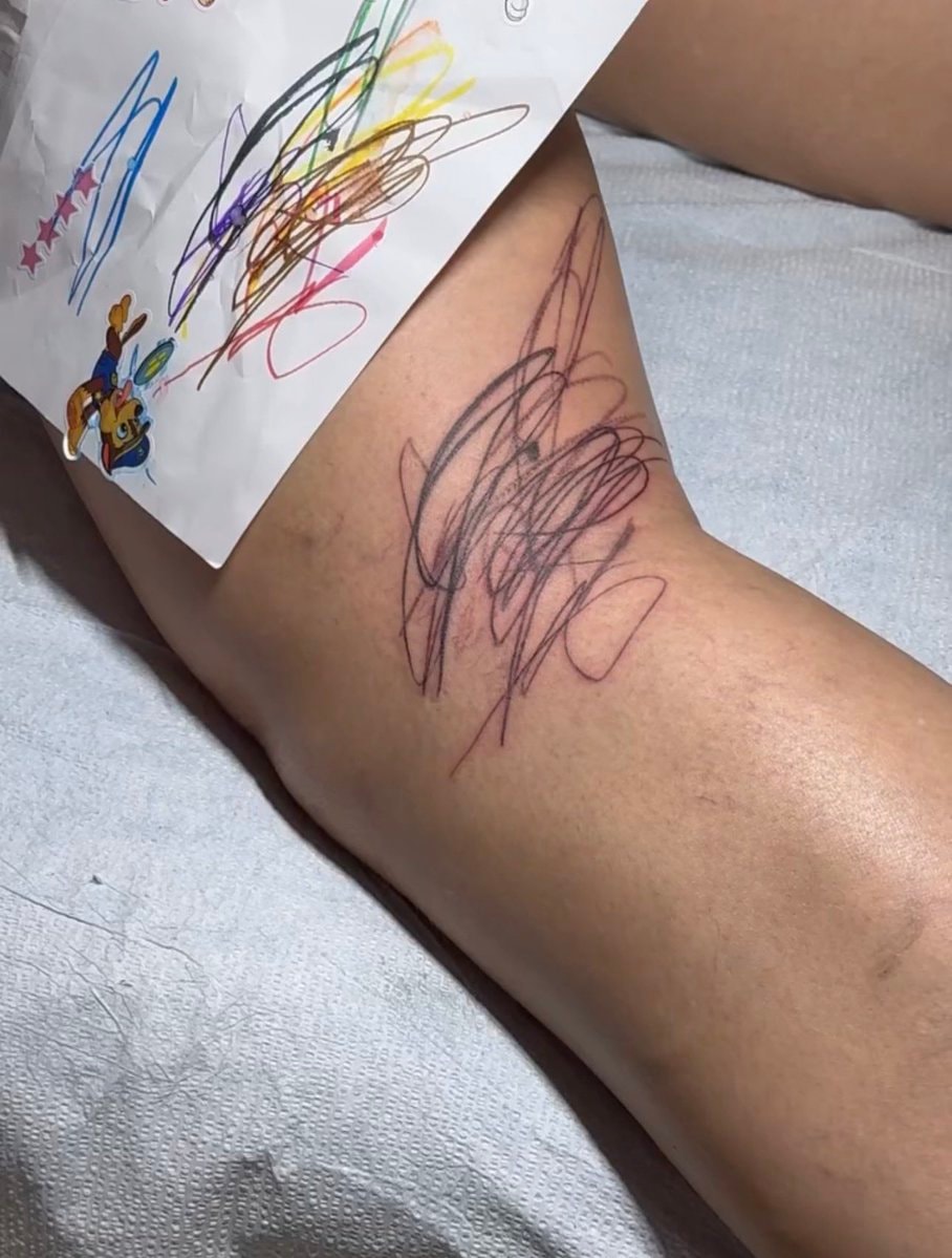 Rihanna Riot Rose HAPPY tattoo (photo 2 of 2)