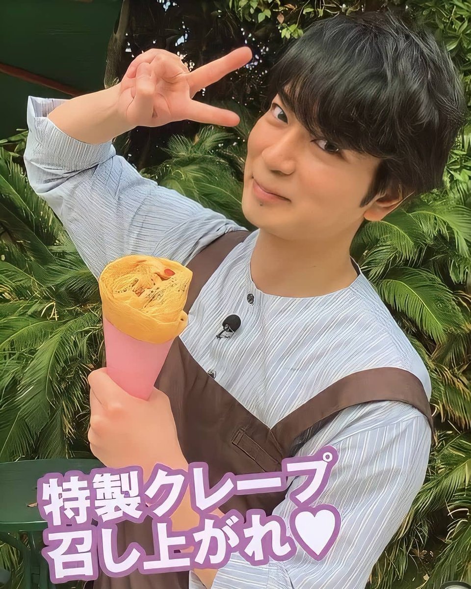 young man with crepe and peace sign (photo 1 of 4)
