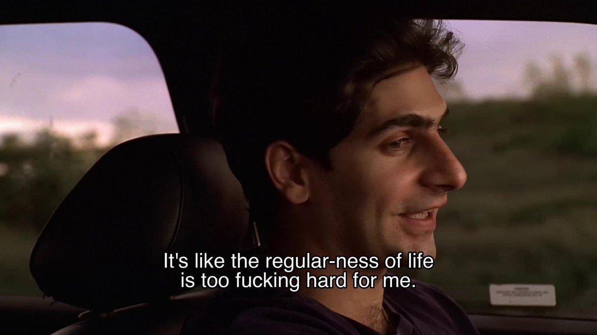 man in car pensive expression