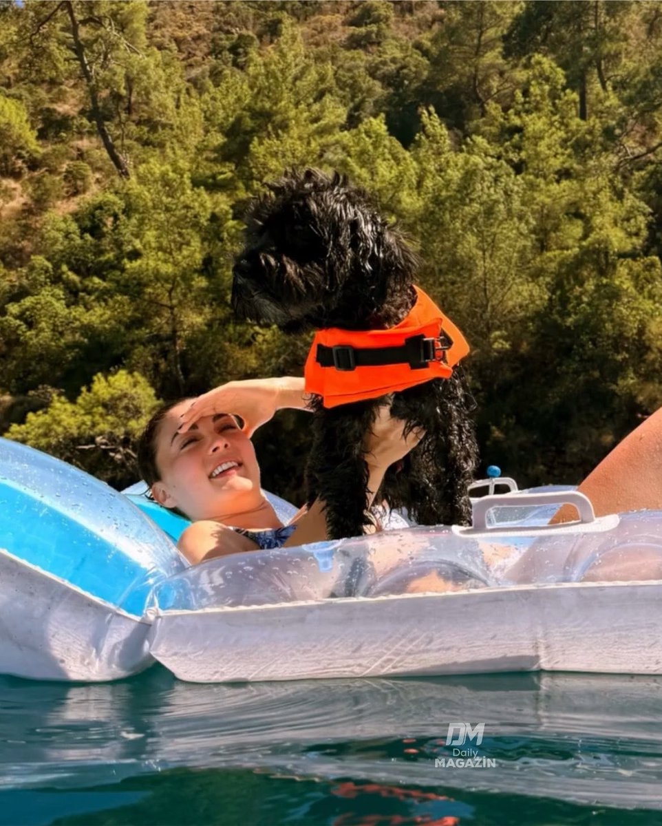 Burcu Özberk with her dog on a raft Burcu Özberk with her dog on a raft