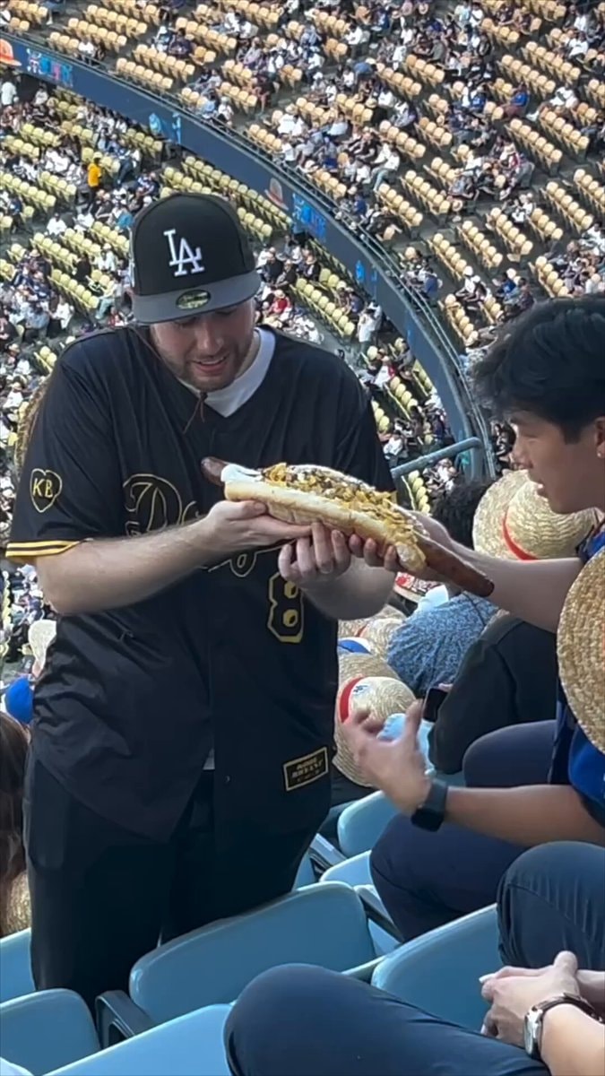 two men baseball game large hot dog