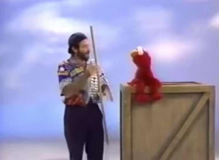 Elmo makes Robin Williams laugh