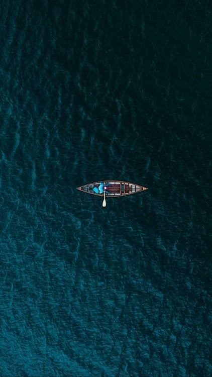 Sailboat lost in blue water (photo 4 of 4)