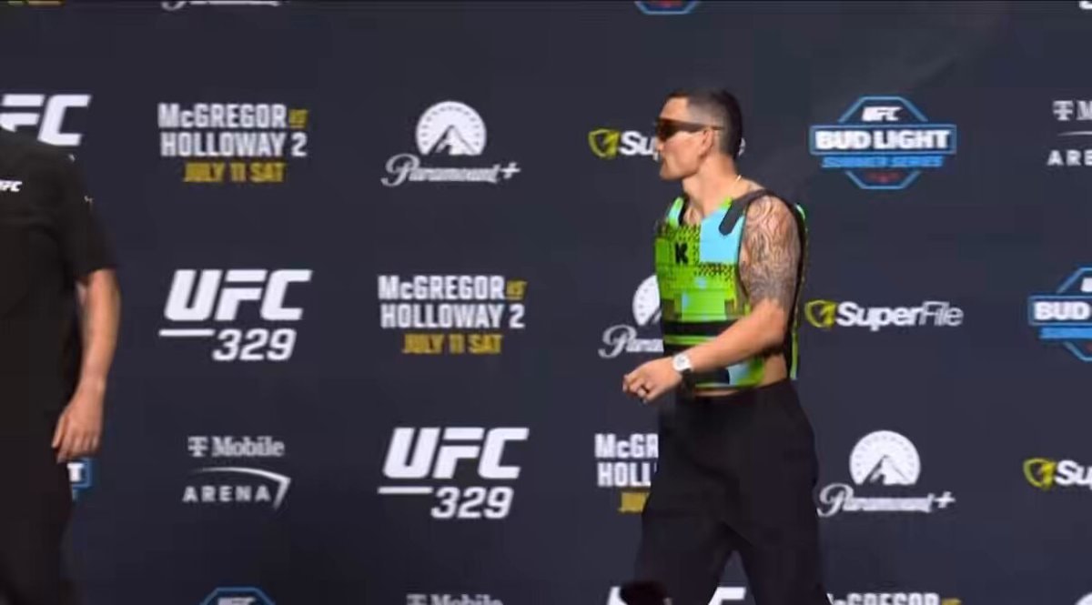 Conor McGregor snatches Max Holloway's glasses at UFC 329 press conference