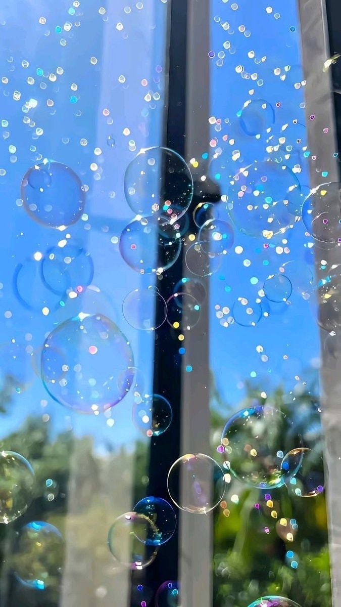 Iridescent bubbles in blue sky ✨